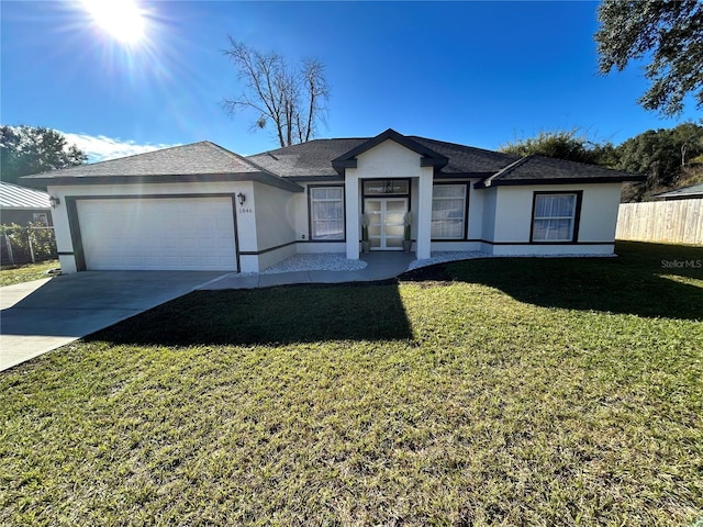 ranch-style house with a garage and a front yard