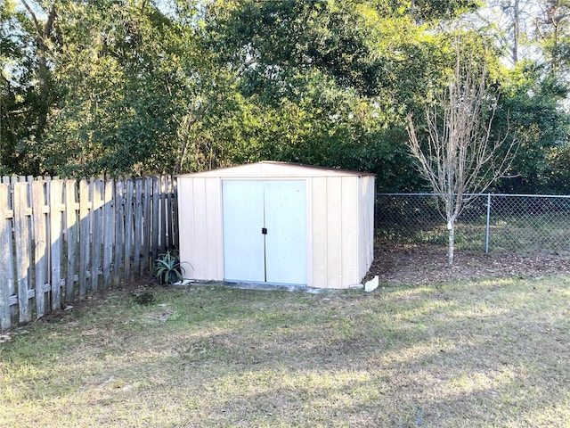 view of outdoor structure with a lawn