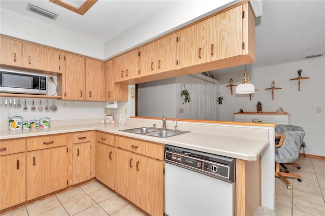 kitchen with sink, kitchen peninsula, white dishwasher, a textured ceiling, and light tile patterned flooring