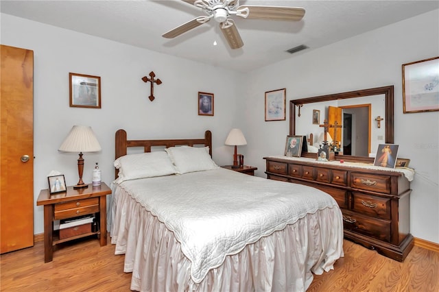 bedroom featuring ceiling fan and light hardwood / wood-style flooring