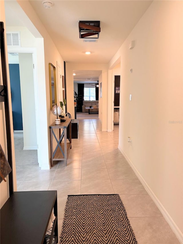 hallway featuring light tile patterned flooring