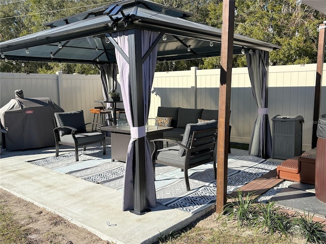 view of patio featuring an outdoor hangout area and a gazebo