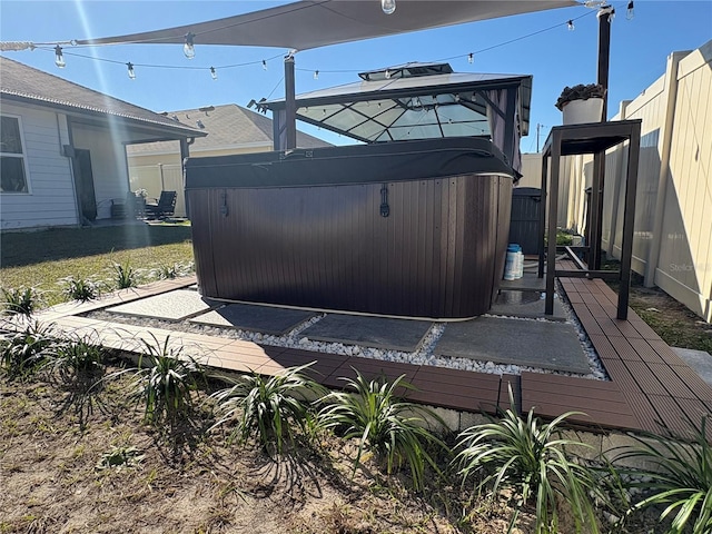 exterior space with a hot tub