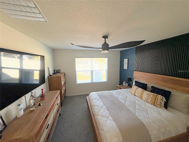 bedroom with ceiling fan, a textured ceiling, carpet floors, and vaulted ceiling