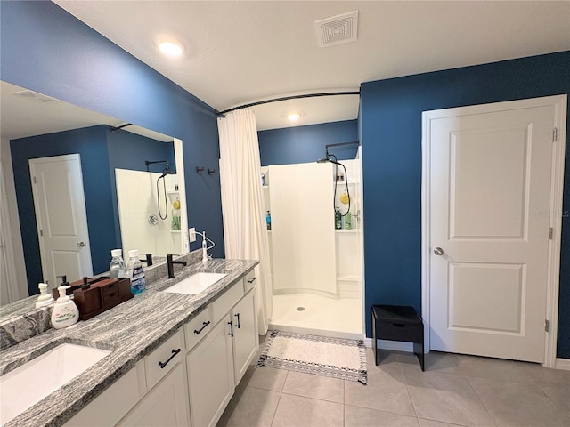 bathroom featuring tile patterned floors, vanity, and a shower with shower curtain