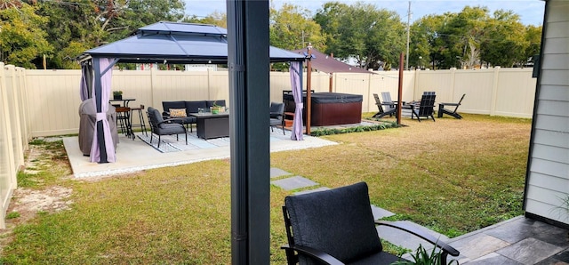 view of yard featuring a gazebo, a hot tub, and a patio