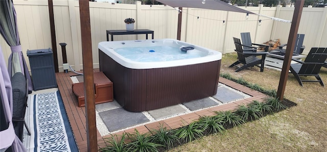 view of patio with a wooden deck and a hot tub