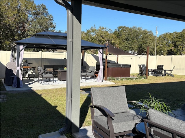 view of yard featuring a gazebo, a hot tub, and a patio