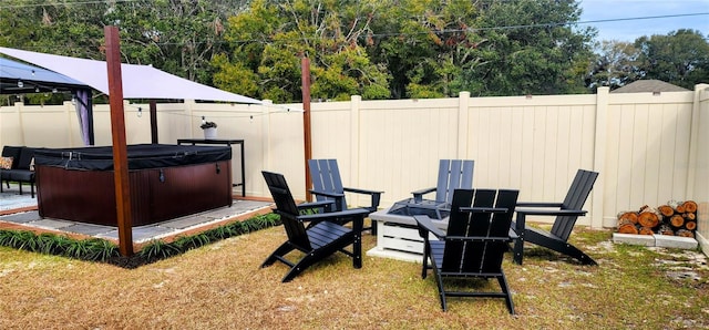 view of yard with a hot tub