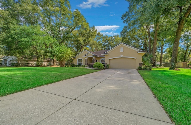 ranch-style house featuring a garage and a front yard