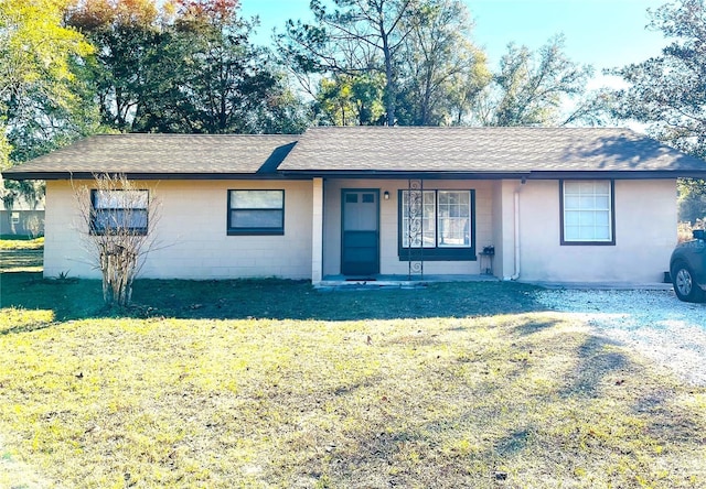 single story home featuring a front yard