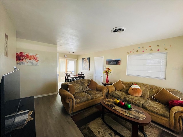 living room with dark hardwood / wood-style flooring