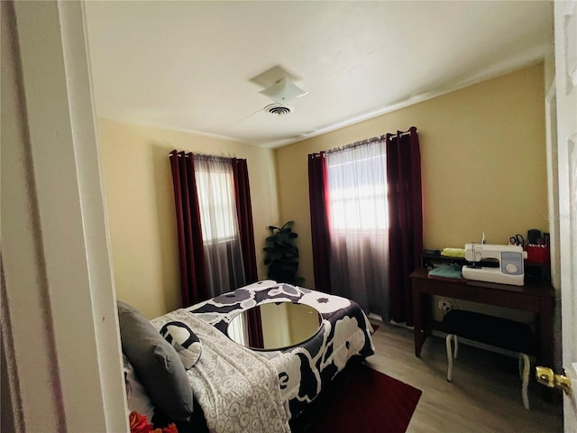 bedroom featuring wood-type flooring