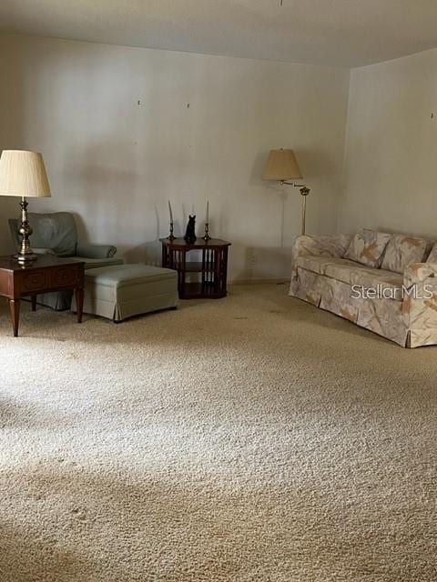 unfurnished living room featuring carpet flooring