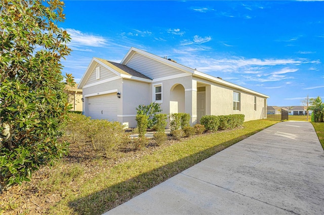 view of side of property with a garage