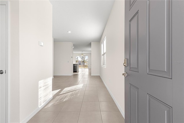 hallway with light tile patterned flooring