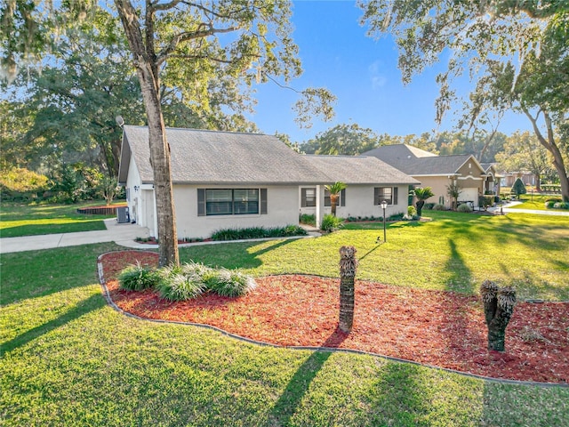 ranch-style home featuring a front yard