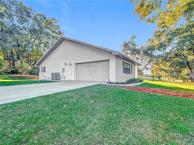 view of side of home featuring a lawn and central AC unit