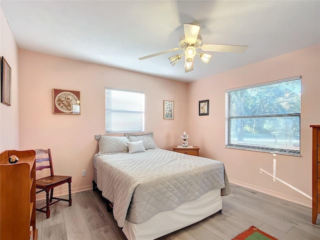 bedroom featuring ceiling fan and light hardwood / wood-style flooring