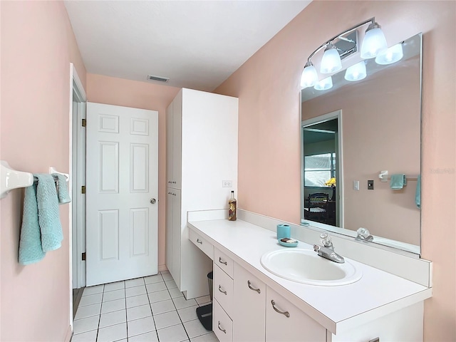 bathroom with tile patterned flooring and vanity