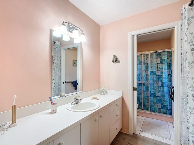 bathroom with vanity, toilet, and walk in shower