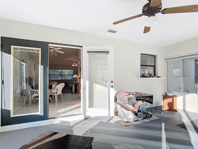 entrance to property with ceiling fan