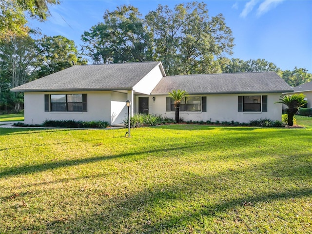 ranch-style home featuring a front yard