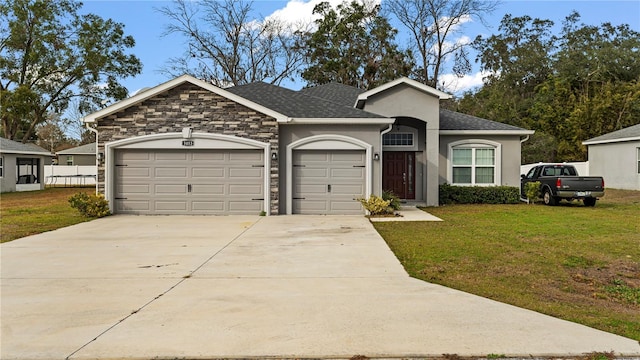 ranch-style home with a front yard and a garage