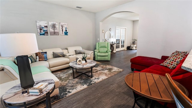 living room featuring french doors and dark hardwood / wood-style flooring