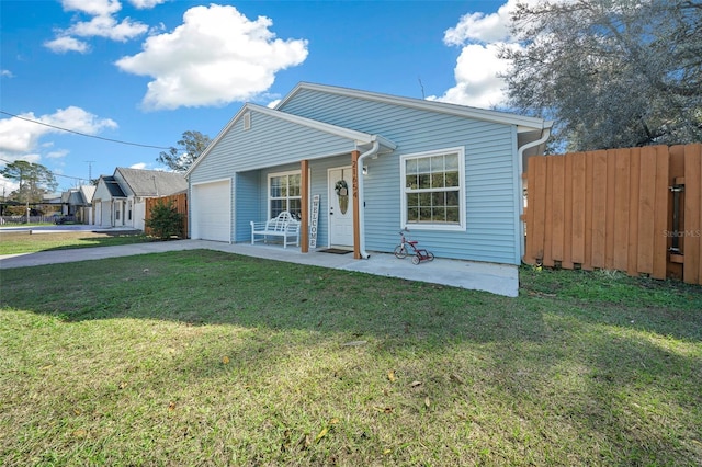 view of front of house with a porch, a garage, and a front lawn