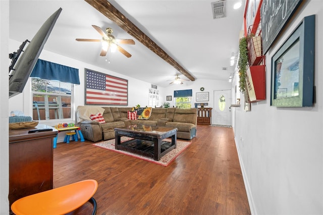 living room featuring vaulted ceiling with beams, a healthy amount of sunlight, and hardwood / wood-style flooring