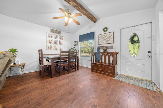 dining space with vaulted ceiling with beams, ceiling fan, and dark hardwood / wood-style flooring