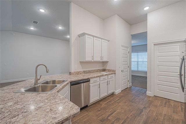 kitchen with dishwasher, white cabinets, sink, dark hardwood / wood-style floors, and light stone countertops