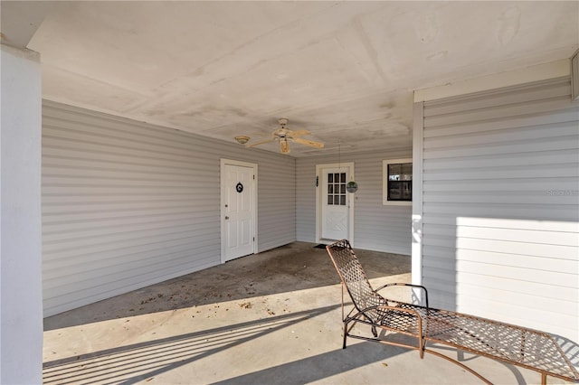 entrance to property with ceiling fan