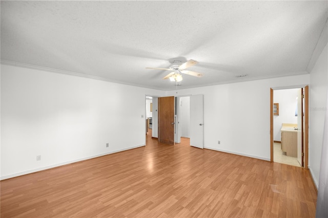 unfurnished bedroom with crown molding, ensuite bath, ceiling fan, a textured ceiling, and light hardwood / wood-style floors