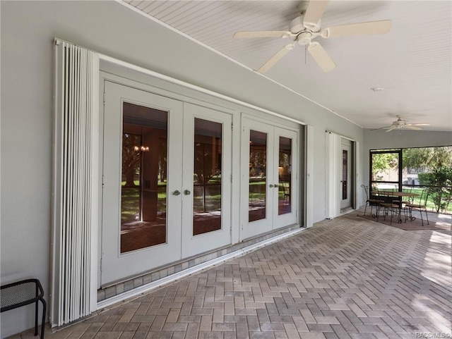 unfurnished sunroom with french doors and ceiling fan