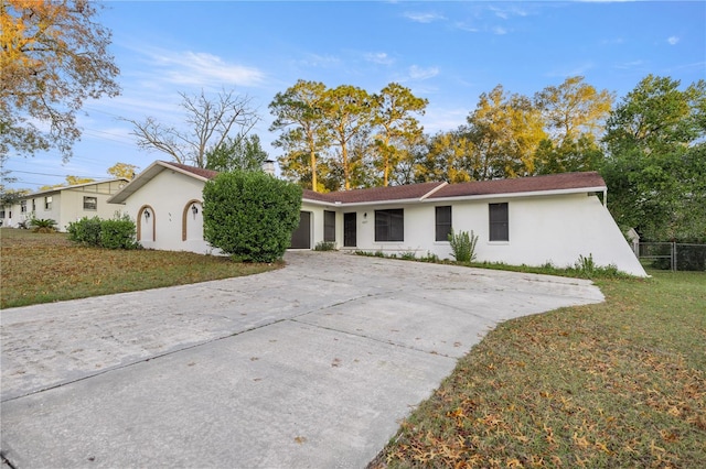 ranch-style home with a front yard