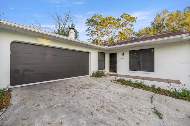 property entrance with a garage