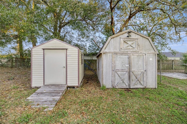 view of outdoor structure featuring a lawn