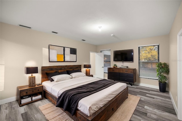 bedroom featuring wood-type flooring