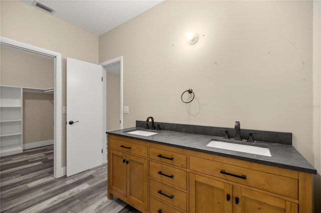 bathroom featuring hardwood / wood-style flooring and vanity