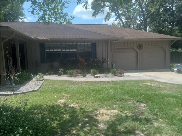 single story home with a front lawn and a garage