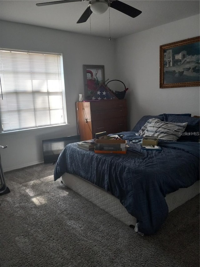 carpeted bedroom featuring ceiling fan