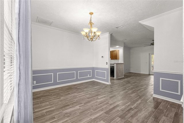 interior space featuring a textured ceiling, dark wood-type flooring, and ornamental molding