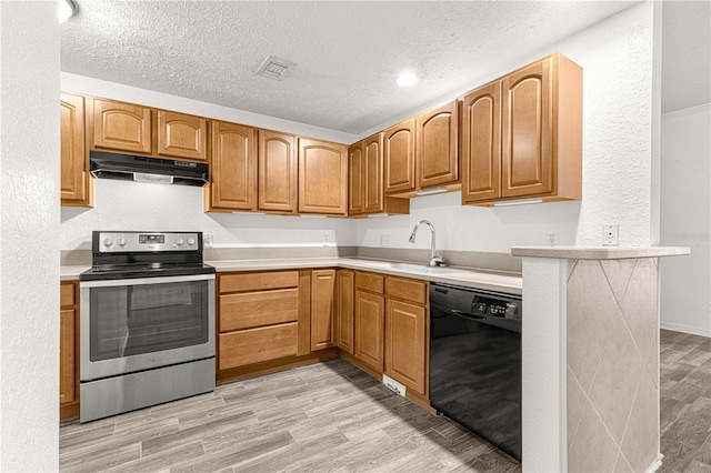 kitchen with a textured ceiling, sink, dishwasher, light hardwood / wood-style floors, and stainless steel electric range