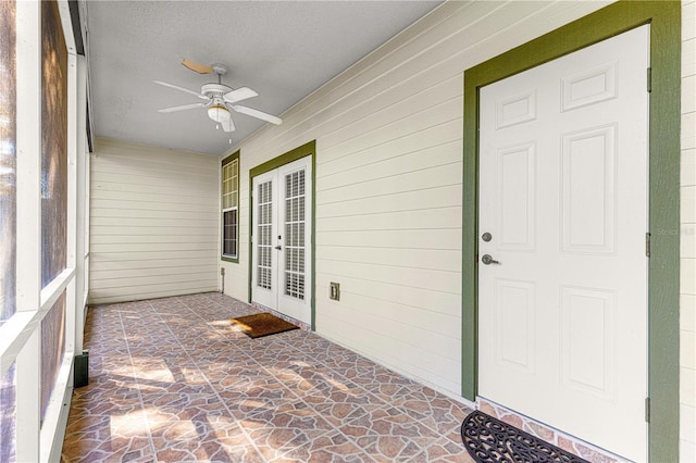 doorway to property with ceiling fan and french doors