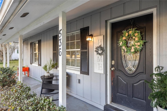 doorway to property featuring a porch