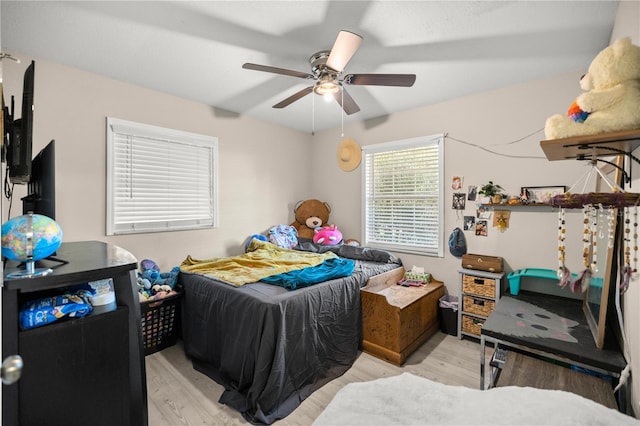 bedroom featuring ceiling fan and light hardwood / wood-style floors