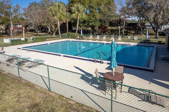 view of swimming pool with a patio