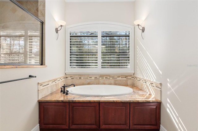 bathroom featuring a tub to relax in